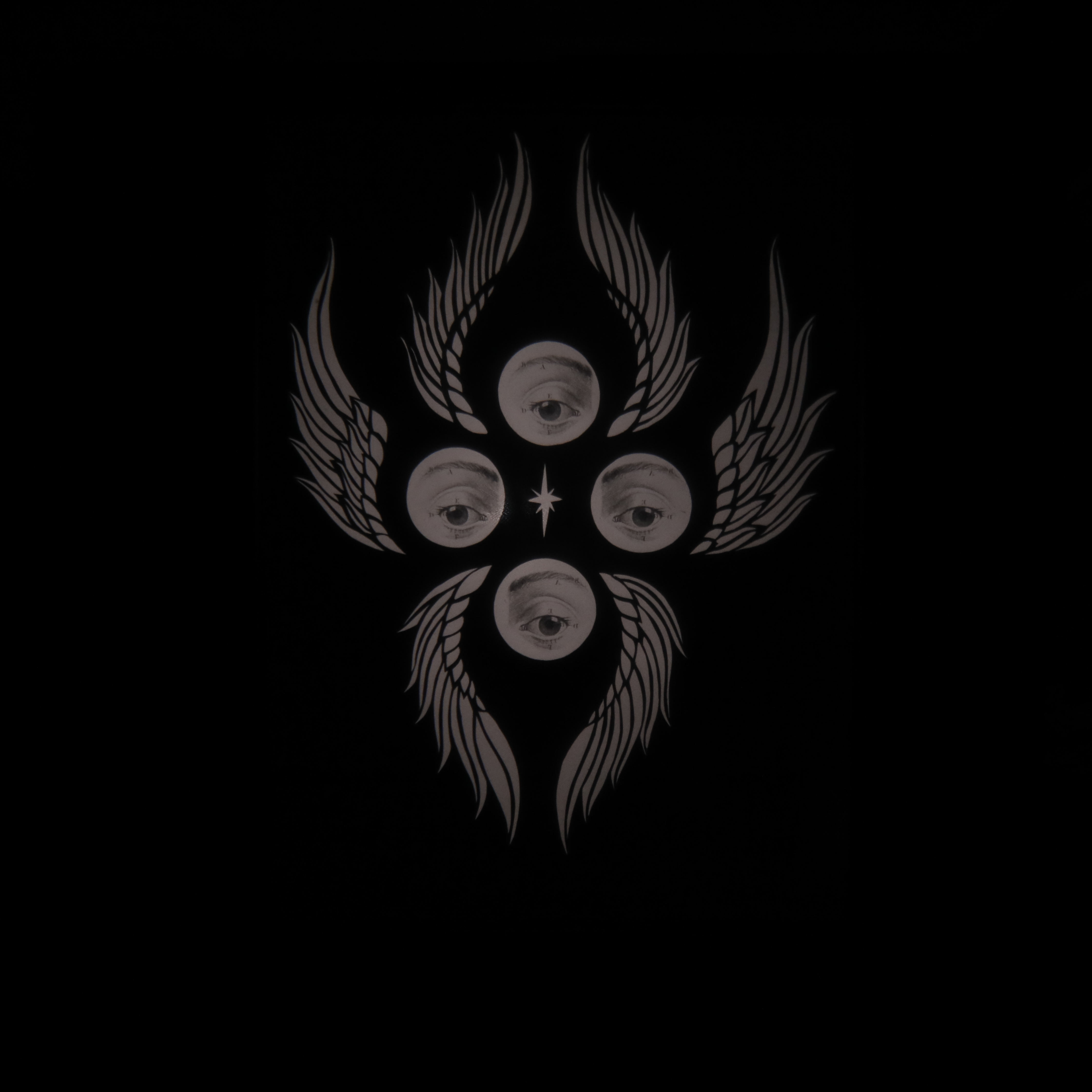 An image with four eyes and six wings in the style of a "biblically accurate angel".