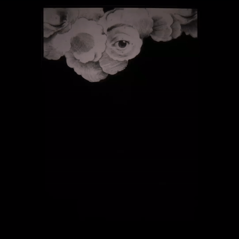 A gif of a cloud with eyes on it emitting two lightning bolts.